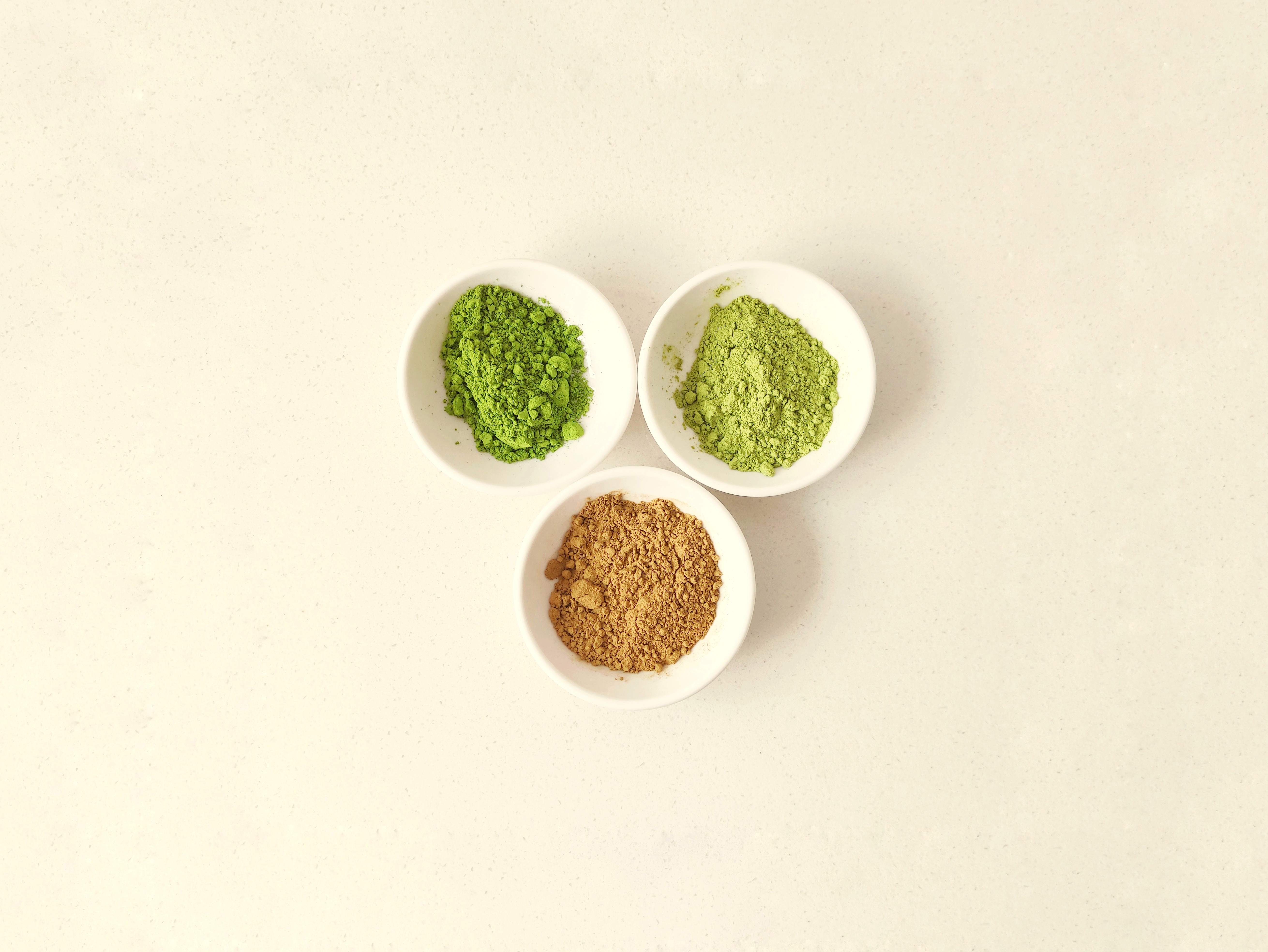 Three bowls of matcha powder