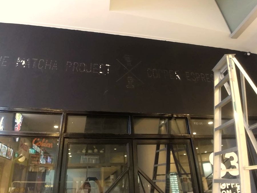 The Matcha Project sign coming down at The Sail